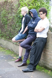 3 male teenagers - street - leaning on wall Oct12
